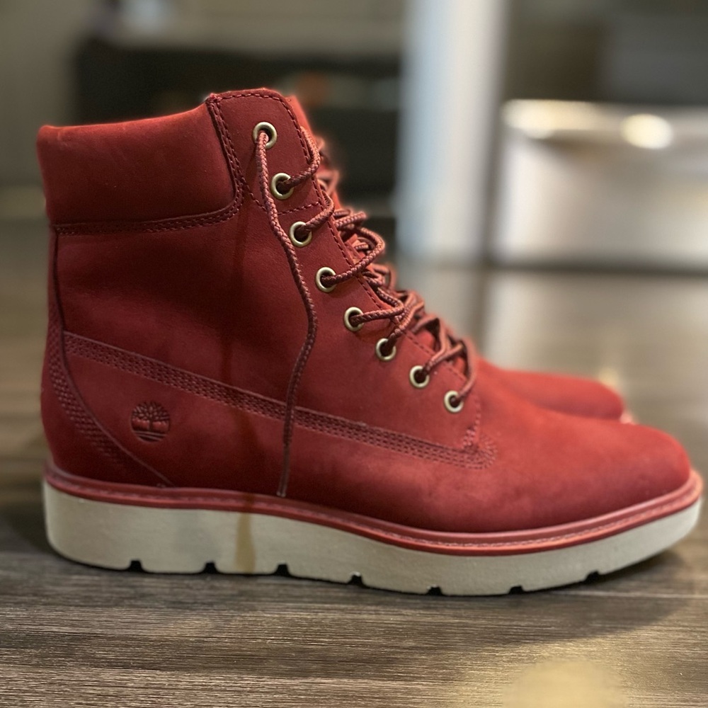Women’s maroon Timberland Boots.